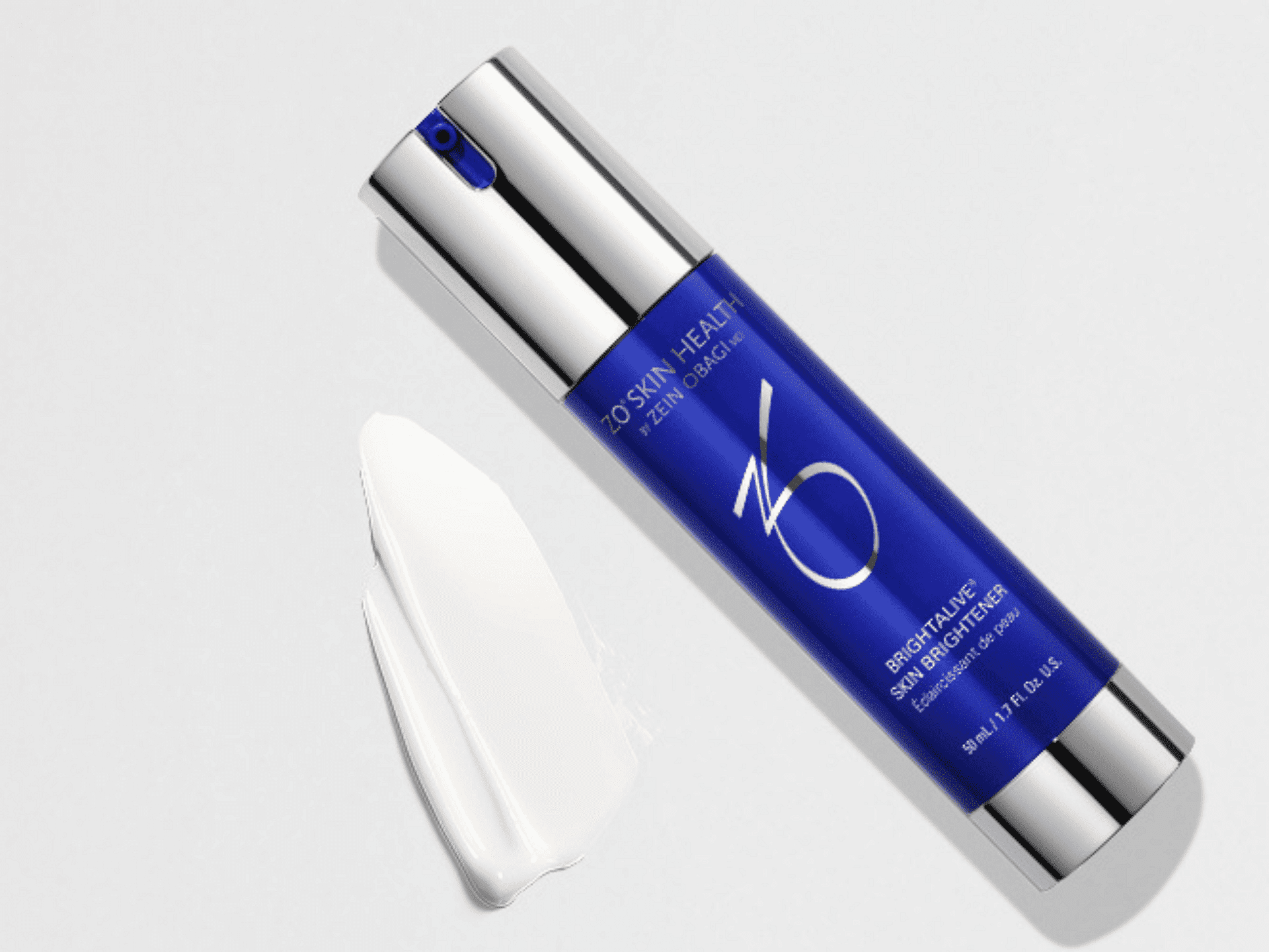 Blue bottle of ZO Skin Health cream with white cream smear on light grey background.