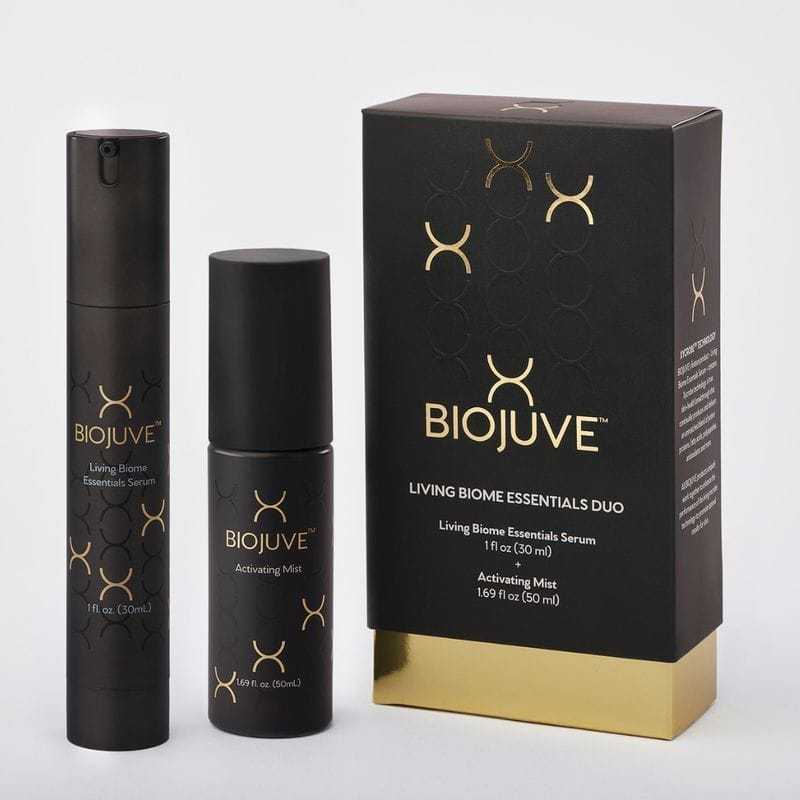 BioJuve Living Biome Essentials Duo with serum and mist in sleek black and gold packaging.